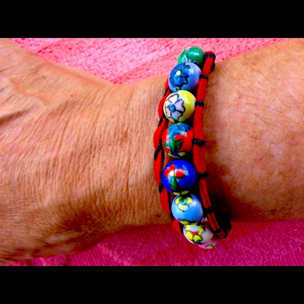 Painted round ceramic beaded bracelet.